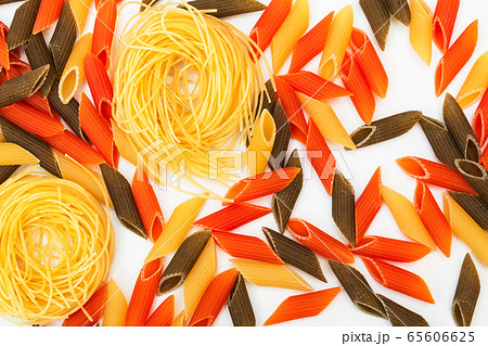 multi-colored pasta on white background multi-colored pasta on white background 65606625