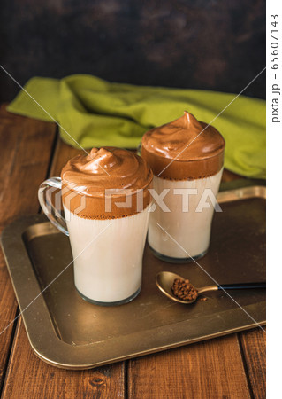 Close up of two glasses with trendy coffee Dalgona Close up of two glasses with trendy coffee Dalgona 65607143