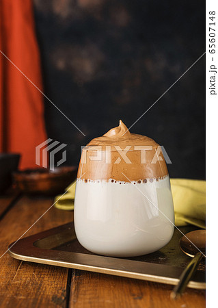 A glass of trendy instant whipped coffee Dalgona A glass of trendy instant whipped coffee Dalgona 65607148