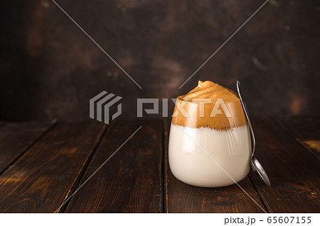 Dalgona coffee, a whipped trendy instant coffee Dalgona coffee, a whipped trendy instant coffee 65607155