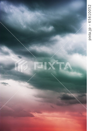 Natural sky composition. Dark ominous colorful storm rain clouds. Dramatic sky. Overcast stormy cloudscape. Thunderstorm. Element of apocalypse design. Toned. Natural sky composition. Dark ominous colorful storm rain clouds. Dramatic sky. Overcast stormy cloudscape. Thunderstorm. Element of apocalypse design. Toned. 65610052