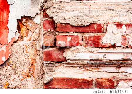 Texture of a brick wall with cracks and scratches 65611432