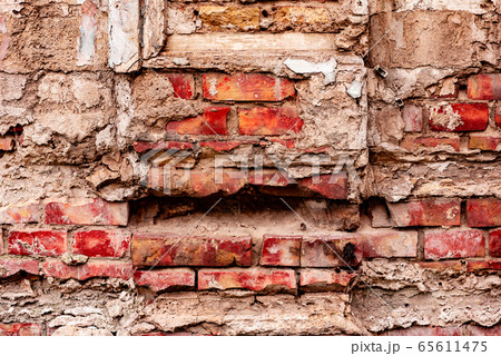 Texture of a brick wall with cracks and scratches 65611475