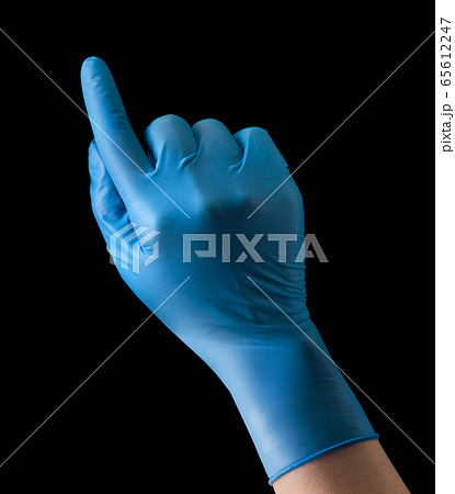Doctor's hand in medical gloves touching screen by Doctor's hand in medical gloves touching screen by 65612247