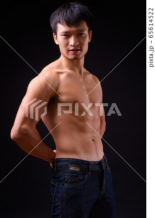 Portrait of young muscular Asian man shirtless 65614522