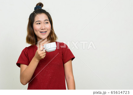 Portrait of young Asian woman with short hair Portrait of young Asian woman with short hair 65614723