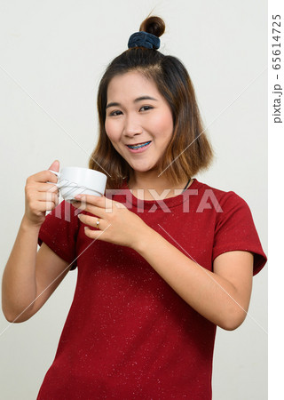 Portrait of young Asian woman with short hair Portrait of young Asian woman with short hair 65614725
