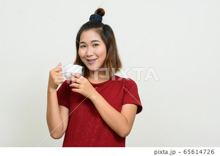 Portrait of young Asian woman with short hair Portrait of young Asian woman with short hair 65614726