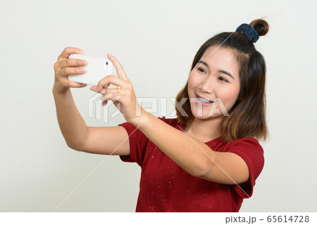 Portrait of young Asian woman with short hair Portrait of young Asian woman with short hair 65614728