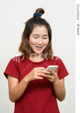 Portrait of young Asian woman with short hair Portrait of young Asian woman with short hair 65614732