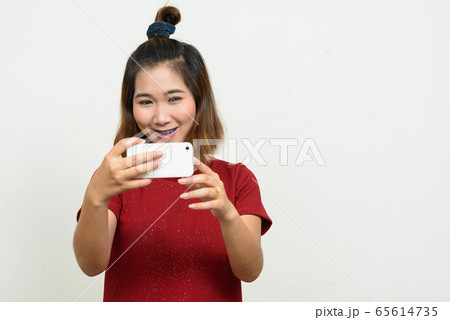 Portrait of young Asian woman with short hair Portrait of young Asian woman with short hair 65614735