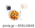 Trendy pancake cereal meal with blueberries and milk on white background. Tiny baked pancakes. Breakfast food. 65614848