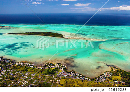 The view from the bird's eye view on the coast of Mauritius. Amazing landscapes of Mauritius.Beautiful coral reef of the island The view from the bird's eye view on the coast of Mauritius. Amazing landscapes of Mauritius.Beautiful coral reef of the island 65616283