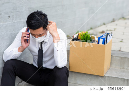 Asian man being fired 65618904