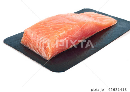 fillet of red fish in vacuum packing. Isolated on white fillet of red fish in vacuum packing. Isolated on white 65621418
