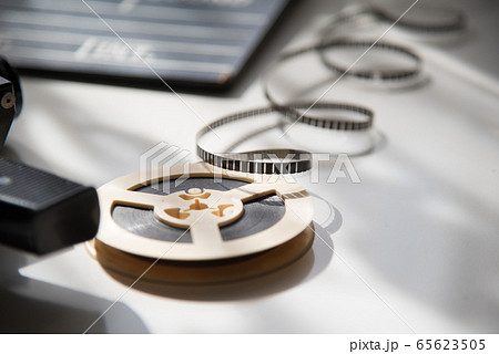 Unwound 8mm film strip on a light background with 65623505