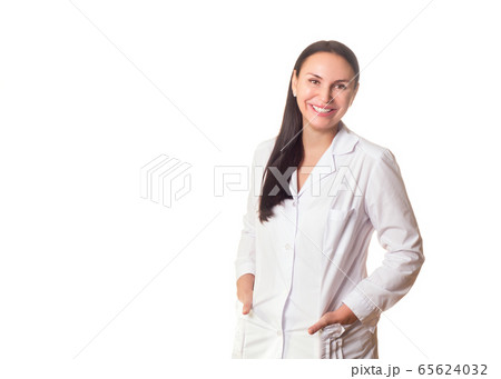 Family doctor, therapist, physician, dentist or cosmetologist. Caucasian friendly smiling adult woman in medical gown, half-length portrait, isolated on white. Family doctor, therapist, physician, dentist or cosmetologist. Caucasian friendly smiling adult woman in medical gown, half-length portrait, isolated on white. 65624032