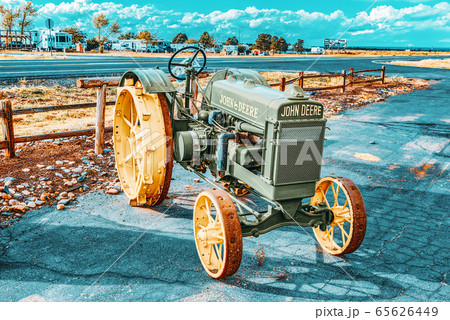 An old tractor stands in the fields of Arizona. An old tractor stands in the fields of Arizona. 65626449