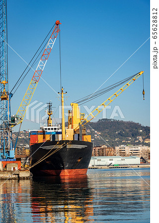 Container ship and cranes in the seaport of La Spezia Liguria Italy Container ship and cranes in the seaport of La Spezia Liguria Italy 65628812