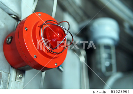 Red warning light of an emergency beacon at an Red warning light of an emergency beacon at an 65628962