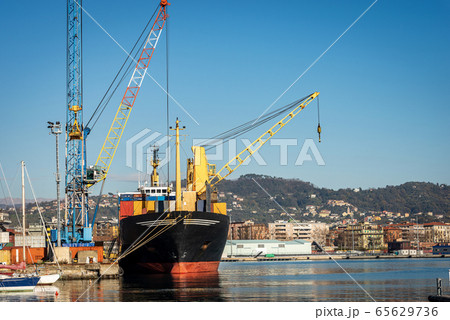 Container ship and cranes in the seaport of La Spezia Liguria Italy Container ship and cranes in the seaport of La Spezia Liguria Italy 65629736