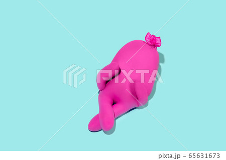 Life of rubber glove like a person - protective wear isolated on blue studio background 65631673