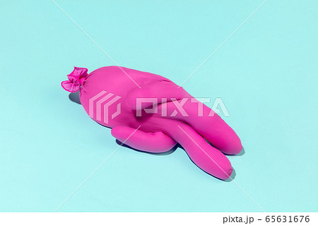 Life of rubber glove like a person - protective wear isolated on blue studio background Life of rubber glove like a person - protective wear isolated on blue studio background 65631676