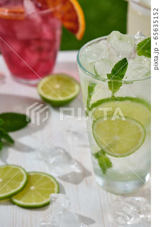 Assorted cocktail, lime, orange and pineapple. Summer concept. 65635152