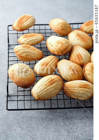 Traditional french madeleine cookies or cakes with in a vintage. Traditional french madeleine cookies or cakes with in a vintage. 65635187