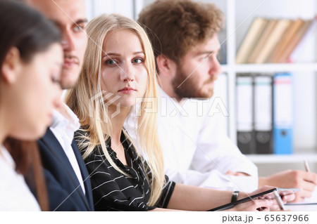 Beautiful smiling businesswoman portrait at workplace Beautiful smiling businesswoman portrait at workplace 65637966