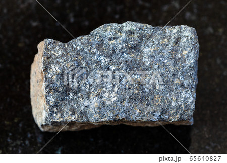 unpolished Zinc ore (Sphalerite) rock on black 65640827