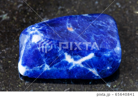 polished Sodalite rock on black 65640841