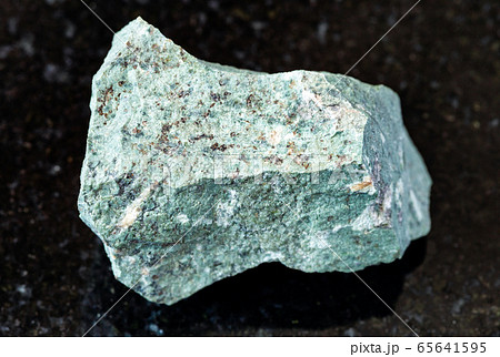 unpolished Tinguaite rock on black 65641595