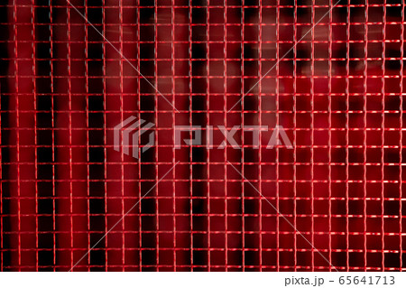 Red colored metal mesh background 65641713