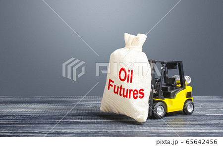 A forklift carries a bag with Oil futures. Trade and transportation of oil. Lack of storage space and oversupply. Low demand. Big discounts and deferred payments. Stabilization of the energy market A forklift carries a bag with Oil futures. Trade and transportation of oil. Lack of storage space and oversupply. Low demand. Big discounts and deferred payments. Stabilization of the energy market 65642456