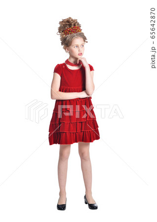 Portrait of girl in red dress posing isolated on white background Portrait of girl in red dress posing isolated on white background 65642870