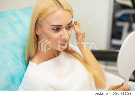 Lip Augmentation In Cosmetology Clinic. Beautiful Woman Getting Beauty Injection For Lips. Lip Augmentation In Cosmetology Clinic. Beautiful Woman Getting Beauty Injection For Lips. 65643153