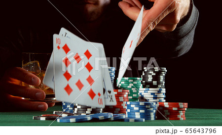 Poker player throwing cards 65643796
