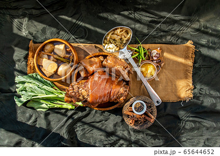 Stewed pork leg with boiling sweet gravy sauce and Stewed pork leg with boiling sweet gravy sauce and 65644652