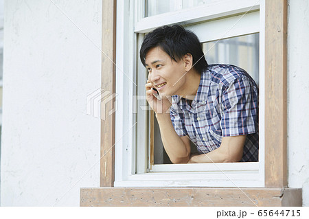 Portrait Of A Young Man Showing His Face Stock Photo