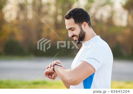 Fitness. Young man running in urban environment 65645204