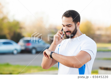 Fitness. Young man running in urban environment 65645220