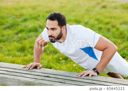 Fitness. Young man running in urban environment Fitness. Young man running in urban environment 65645221