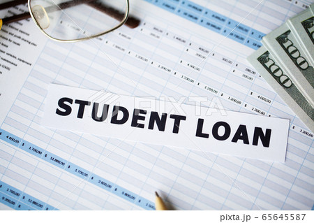 Credit concept. Student loan written on white card. 65645587