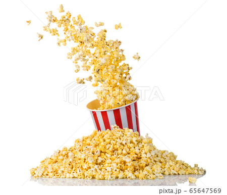Flying popcorn from paper striped bucket and 65647569