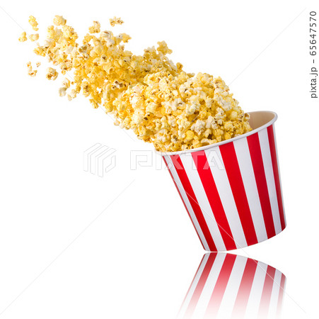 Flying popcorn from paper striped bucket isolated Flying popcorn from paper striped bucket isolated 65647570