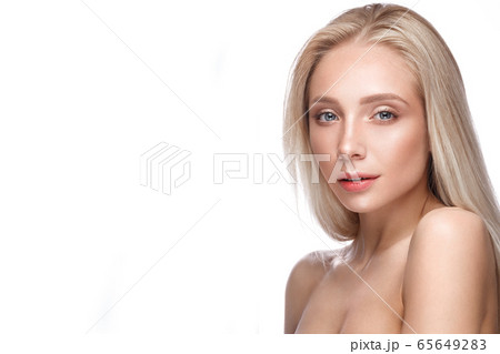 Beautiful young girl with a light natural make-up and perfect skin. 65649283