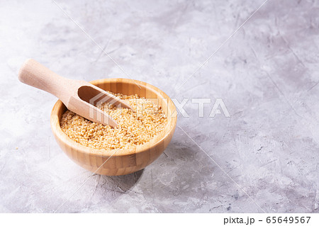 Uncooked raw dry bulgur wheat grains in a bowl 65649567