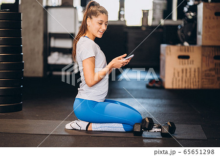 Portrait of attractive young woman doing yoga or pilates exercise Portrait of attractive young woman doing yoga or pilates exercise 65651298