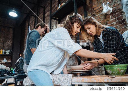 Making a handmade clay pot. Pottery lesson, hobby. 65651360